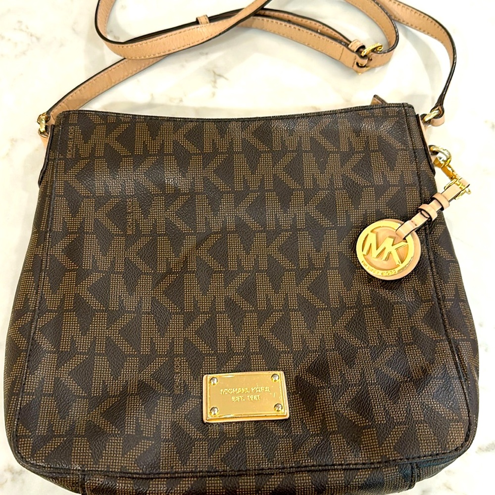 Like new Michale Kors signature brown purse.